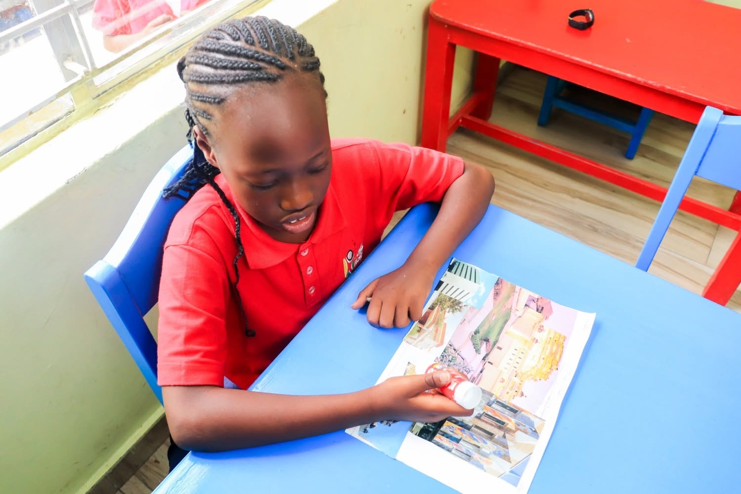 Pupil working on an art and craft collage project