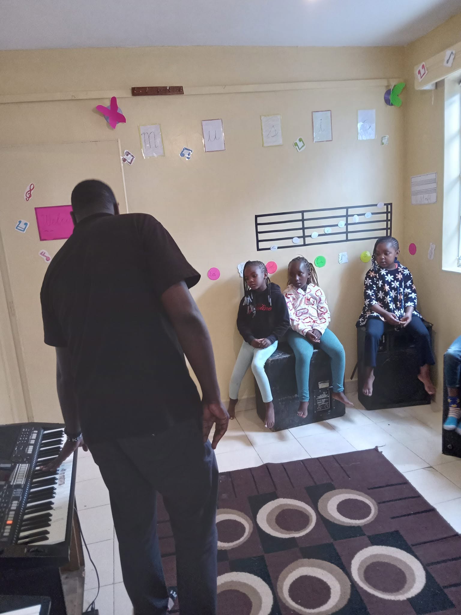 Children in a keyboard and music theory lesson